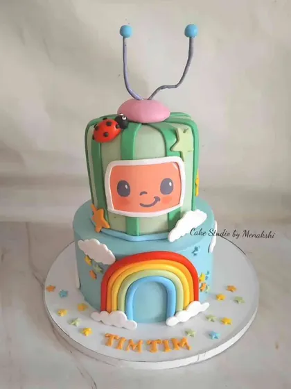 This two-tier Cocomelon cake was designed for a little fan. I recreated the iconic melon TV and rainbow from the show, making it a bright and cheerful centerpiece for a toddler's party.