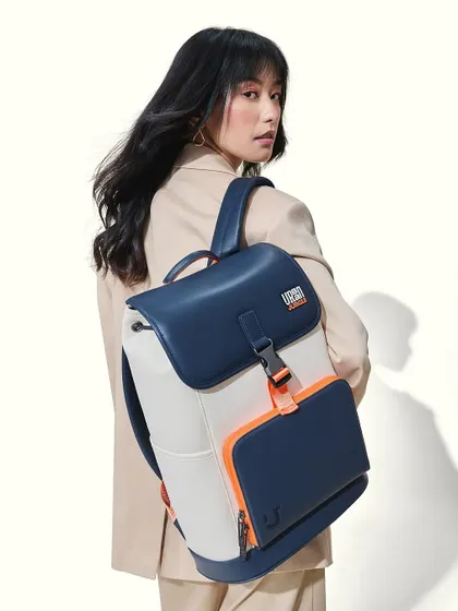 A chic and modern makeup look for the Urban Jungle backpack campaign. The makeup is polished and sophisticated, with a defined eye and a neutral lip to complement the smart-casual styling.
