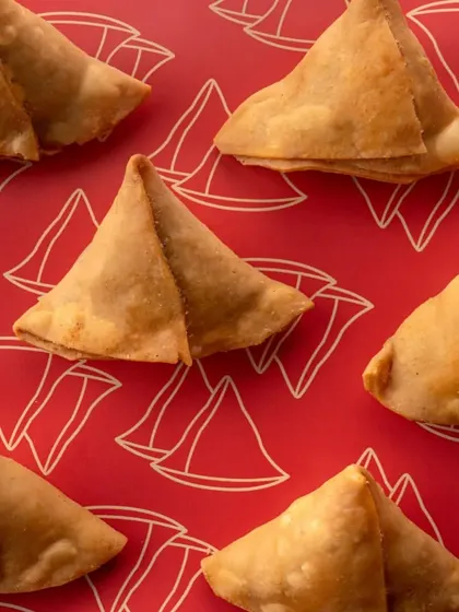 We use creative pattern work and graphic elements in our photography. This shot of samosas against a custom-designed background for A-1 Samosas is part of a complete rebranding project we handled.