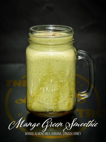 Get your greens in with our Mango Green Smoothie. This nutrient-dense beverage combines mango, banana, and spinach with almond milk and honey for a healthy and delicious boost.