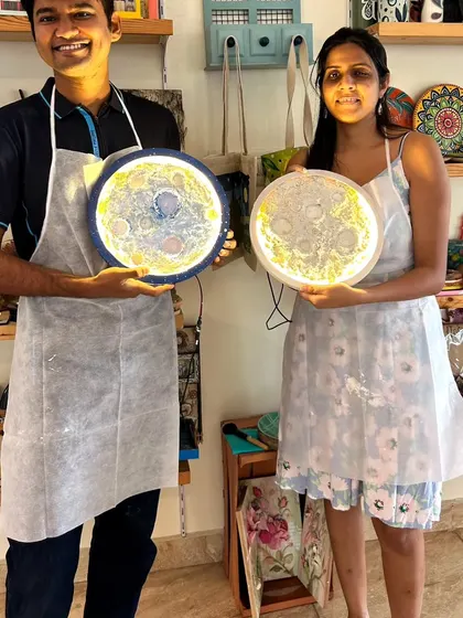 Another happy couple with their finished moon lamps. It's a fun and creative date idea, and you get to take home a piece of art that you made together.