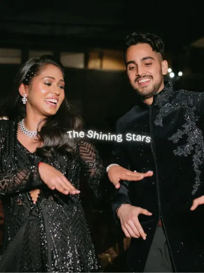 The couple shows off their coordinated dance moves during their Sangeet performance. Their sparkling black outfits perfectly match the glamorous and starry theme of the night.