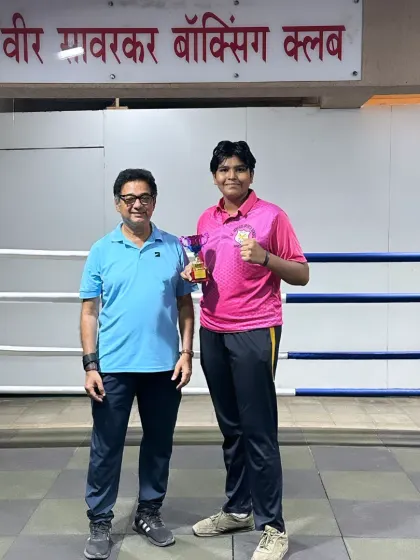 Posing with a champion. It is my honor to guide these young boxers and celebrate their victories with them inside our home gym.