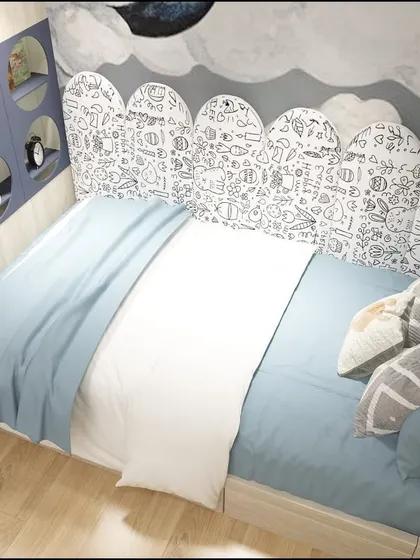 The cozy bed nook under the loft features a fun, doodle-style headboard, making it a perfect little den for dreaming.