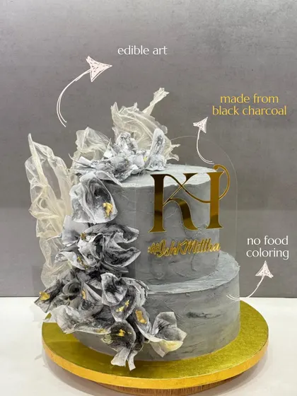 I believe a cake should be both beautiful and pure. This two-tiered edible art piece gets its unique grey hue from natural black charcoal, not artificial food coloring, proving that indulgence never has to compromise on quality.