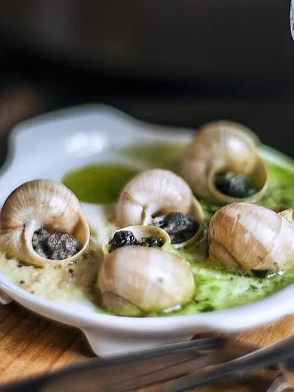 A plate of classic French escargots, showcasing our range of European cuisine.