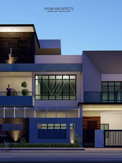 The facade of the Arun Reddy residence in Hosur, designed on a corner plot. The concept plays with solid and void masses, using angular inclined walls to create a unique, contemporary look that is also fully Vastu-compliant.