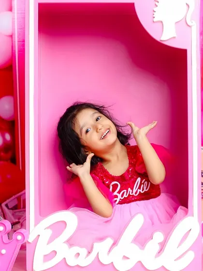 A real-life Barbie doll. This fun and vibrant Barbie-themed shoot lets your child step into a world of pink, sparkle, and imagination.
