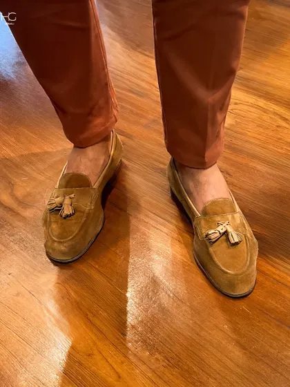 A close-up of my tassel loafers, demonstrating how the right footwear can complete a colorful and stylish office look. The rich tan suede complements the rust trousers perfectly.