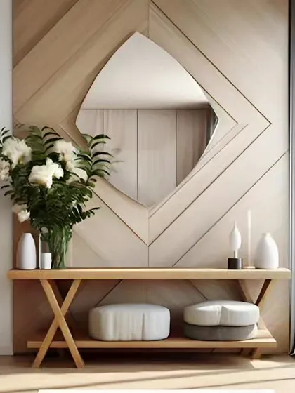 A beautiful entryway console table with a unique geometric mirror. The light wood and soft shapes create a welcoming first impression.