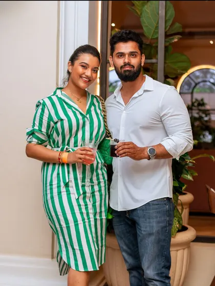 A stylish couple enjoying the event. My mansion attracts a fashionable crowd and provides a worthy backdrop for any celebration.