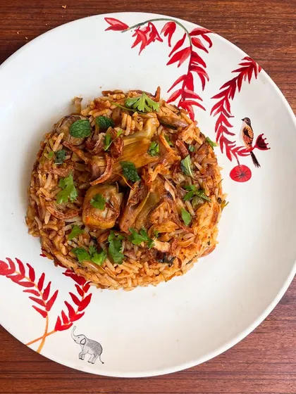 This is my tender jackfruit biryani, and it's not just a pretty face. I cook the jackfruit just right so it soaks up all the masalas like a sponge while staying soft. It's a seasonal vegetarian showstopper.