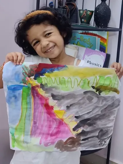 A duplicate of ID 86, this image captures the pure happiness of a child who has just completed a piece of art she loves.