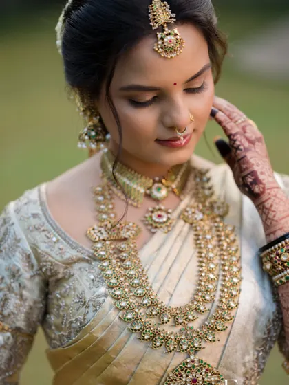 A detailed shot of Sushmitha's makeup, focusing on the soft eye makeup that enhances her expressive eyes.