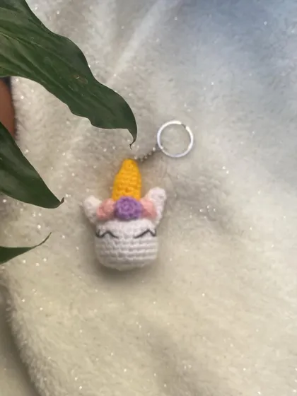 Another shot of the unicorn keychain against a soft, glittery background. These make wonderful party favors or small gifts for anyone who loves fantasy.