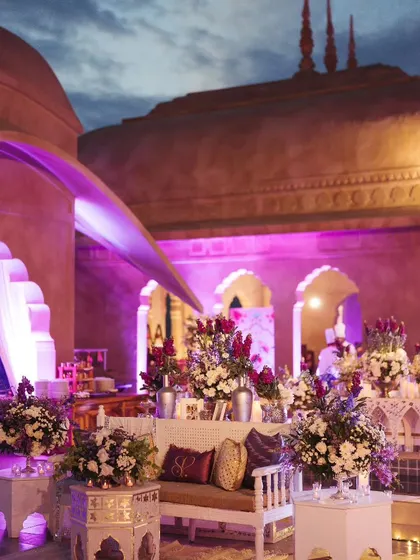 Floral arrangements and personalized cushions added a soft, personal touch to the elegant Sufi Night decor.