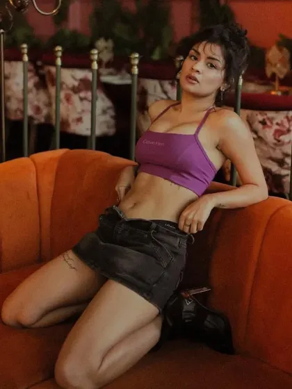 This shot shows the effortless vibe of the look. The makeup is barely there, focusing on glowing skin and natural brows, perfect for a casual, cool aesthetic.
