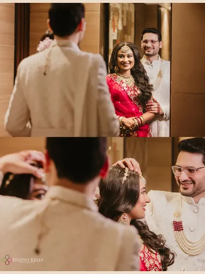 A "first look" moment captured in a mirror, showing the groom's reaction to seeing his bride for the first time.