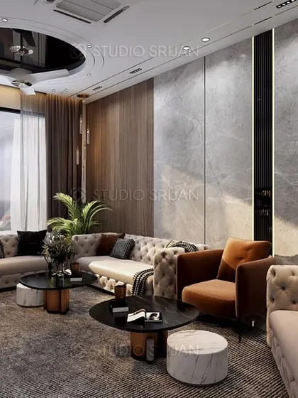 Another view of the Bali Nagar drawing room, showcasing the circular false ceiling detail and the luxurious, layered material palette.