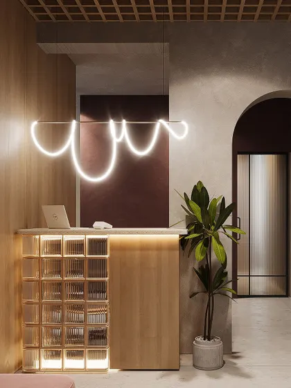 This is the reception area I designed, intended to make a strong first impression. Key features include a custom-designed neon light fixture, a front desk constructed from glass blocks and light wood, and an arched entryway leading further into the office.