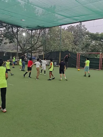 A wide view of a football party in full swing on a professional turf. We manage the game flow to keep everyone engaged.