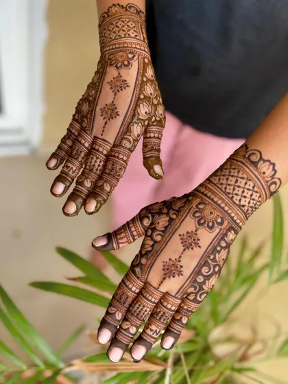 An angled view of the panel-style engagement mehendi.