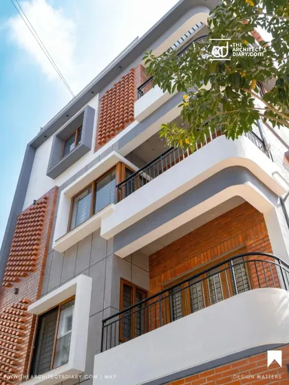 Another angle of the Akshaynagar residence, showing the dynamic composition of different materials and forms.