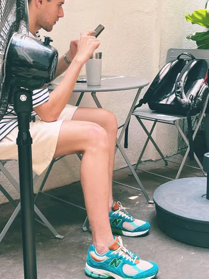 A quiet moment of work and relaxation in our outdoor seating area. We provide the fan, you bring the focus.