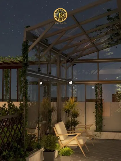 A glasshouse-style terrace at night, offering a magical space to relax under the stars, surrounded by greenery.