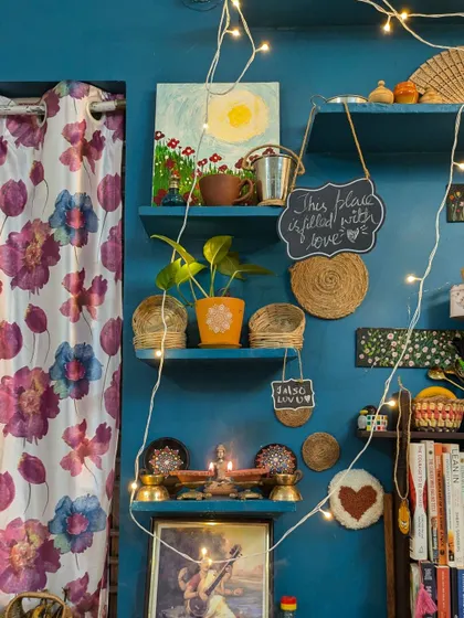 A look at my creative corner at home, decorated for Diwali. My space is filled with art, plants, and fairy lights. It's my personal sanctuary where I bring my ideas to life.