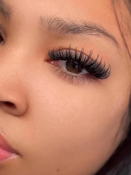 A close-up of a spiky Anime lash set. You can see the distinct separation and length variation that defines this trendy style.