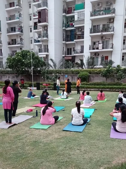 Participants settling into their practice during our community yoga event. We welcome everyone, from beginners to experienced yogis, to join our sessions.