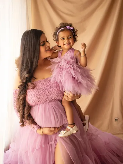 The pure joy of family. I love capturing these beautiful moments between a mother and her child, celebrating the new life that will soon join them.
