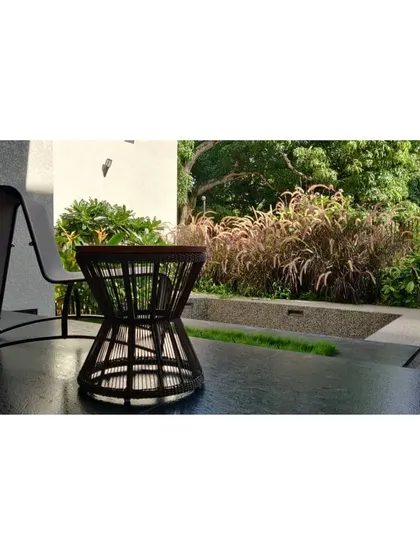 A quiet corner for relaxation, where a modern deck chair overlooks a bed of ornamental grasses. We design these small, intimate moments within the larger landscape for personal retreat.