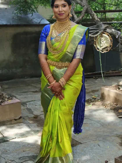 A happy client looking radiant on her special day in our layered temple jewellery. We love seeing our customers shine in our rental pieces.