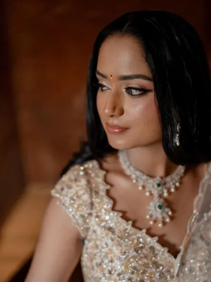 A close-up portrait showcasing the bride's flawless makeup and stunning diamond jewelry. We pay close attention to the details that complete the bridal look.