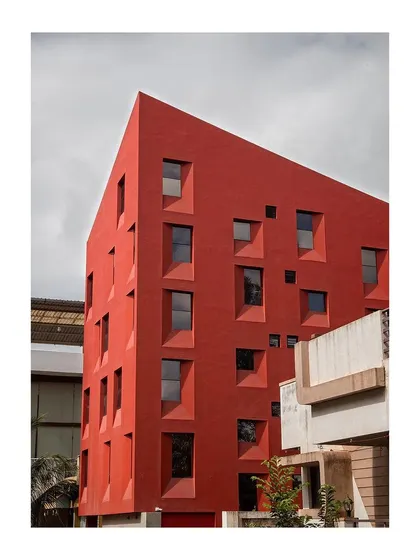 The pattern of fenestrations on the facade is not random but a carefully considered result of layering spaces for living within a compact volume.