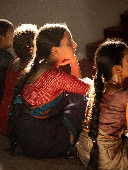 The intense focus of students during a class. This image captures the "Bhava" or feeling of complete absorption in the art form.