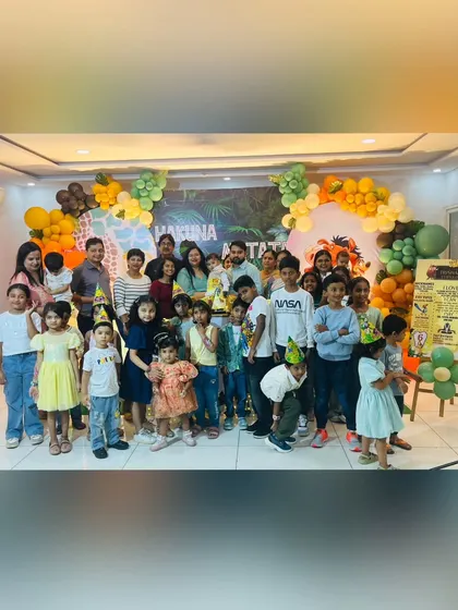 A group photo capturing the joy at Trishaan's "Hakuna Matata" themed first birthday party. It shows all the young guests enjoying the fun, jungle-inspired atmosphere I created.