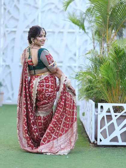 The same happy customer showing the back of the outfit, with the beautiful blouse and hairstyle.