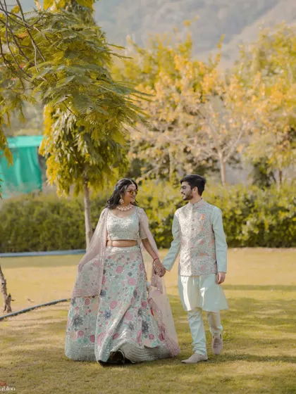 Rishabh and Priya taking a walk in the gardens during their Mehendi. This shot captures a quiet, romantic moment away from the crowds, showcasing their connection.