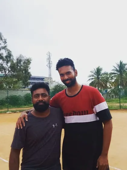 With one of my regular players after a great practice session. Building a strong, positive relationship with my students is key to making progress and enjoying the sport.