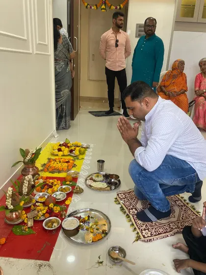 My team member taking blessings during the puja. We work as a family to build dream homes for our clients.