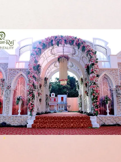 Elegance unfolds at this grand entrance, where every detail is a statement in ground decor excellence. The European-style facade and floral arches create a symphony of sophistication.