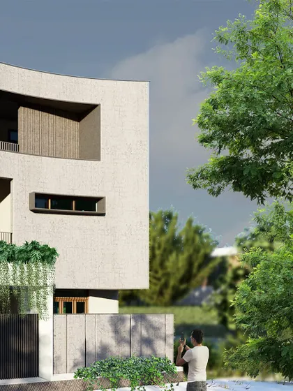 An interesting and minimal elevation idea, this option features a gracefully curved facade. This organic form softens the building's geometry and creates a unique, sculptural presence on the street.
