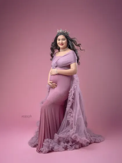This ruffled lavender gown creates a soft, romantic feel. I use a matching pink backdrop to create a gentle, monochromatic look that is both modern and timeless.