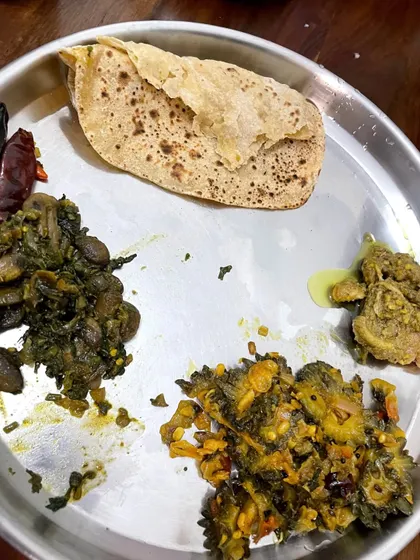 A client's plate with roti, bitter gourd sabzi, and mushroom curry, proving that variety and managing conditions like diabetes can coexist deliciously.