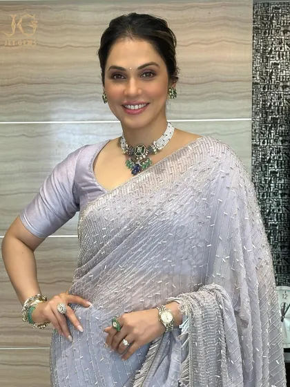 Radiating charm in our stunning Emerald Collection. Isha Koppikar pairs a traditional beaded necklace with statement emerald rings and bracelets for a complete look.