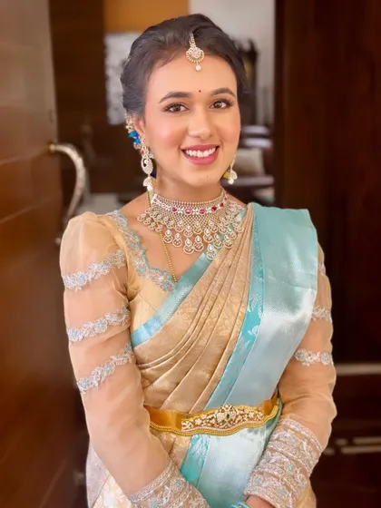Dr. Niharika's bright smile and glowing skin are the highlights of this look. This is what I strive for with every client.