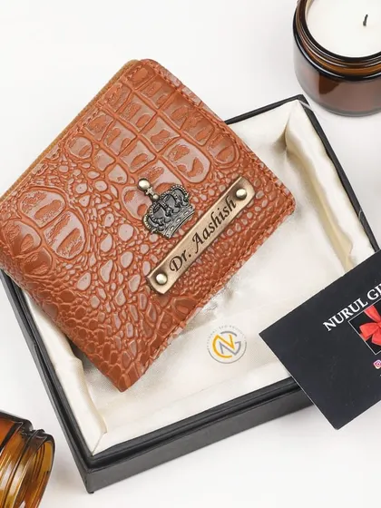 This tan crocodile leather wallet is personalized with a crown charm and a 'Dr.' title, making it a great gift for a doctor.